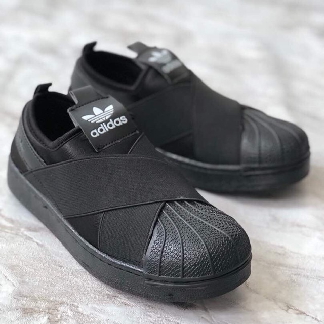 All black adidas store slip ons