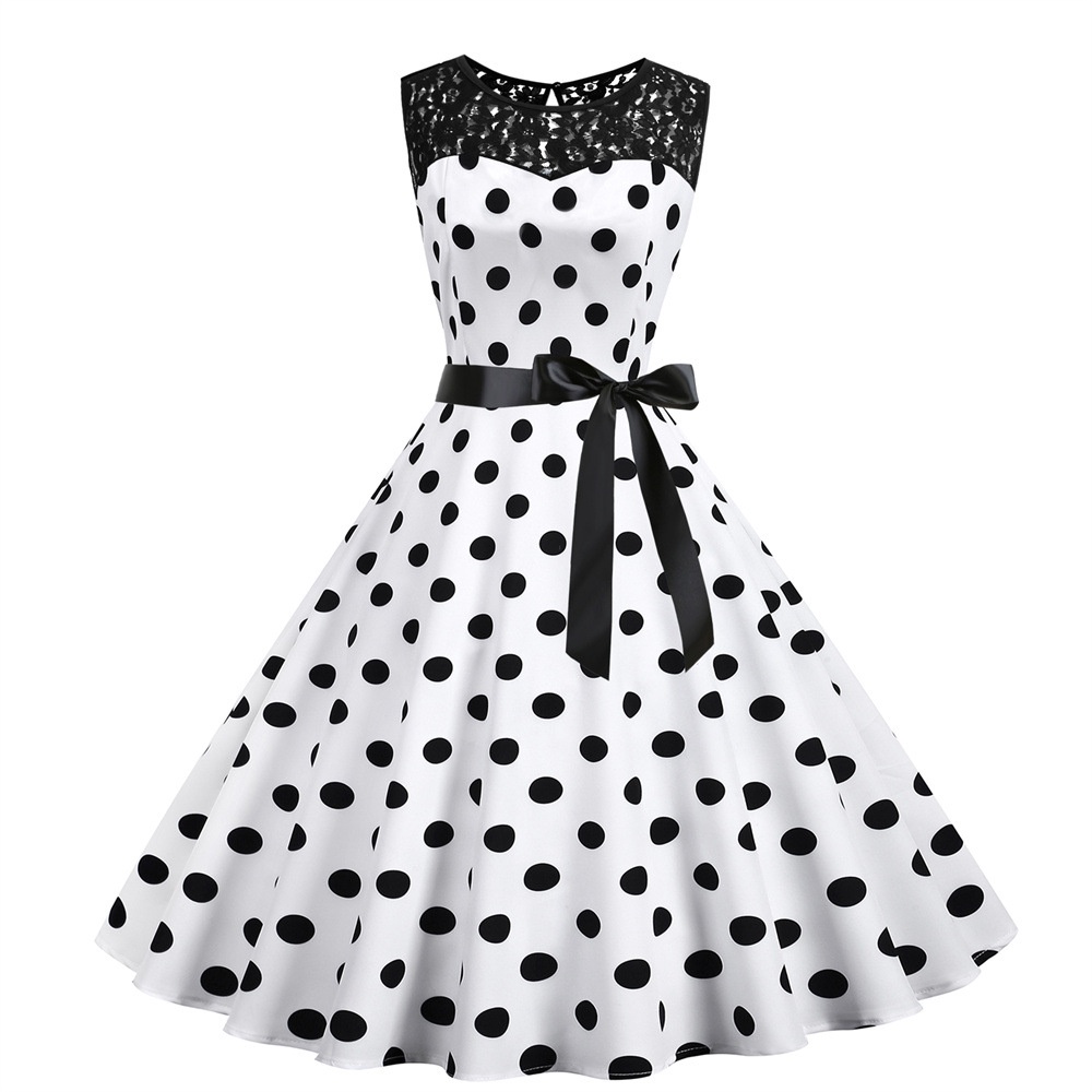 pin up girl. beautiful caucasian woman in a black polka dot dress