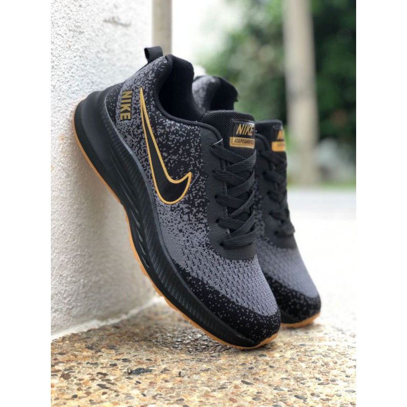 Nike zoom 2025 black and gold