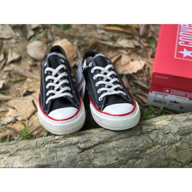 Black converse with red hot sale stripe