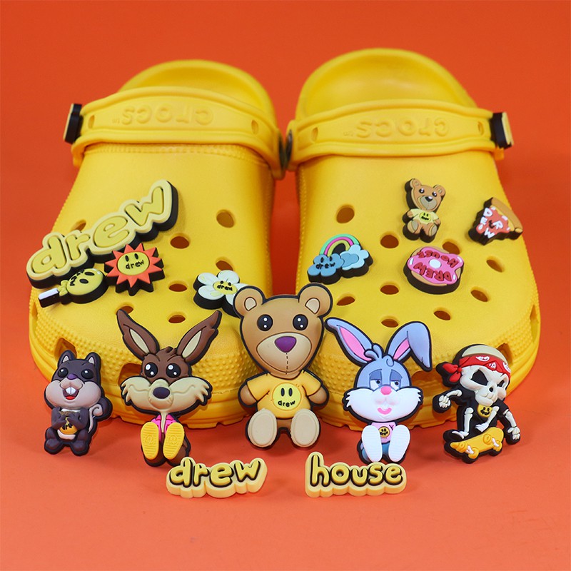 Drew house crocs outlet charms