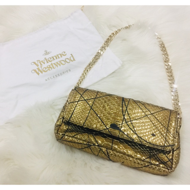 Vivienne westwood best sale gold clutch bag