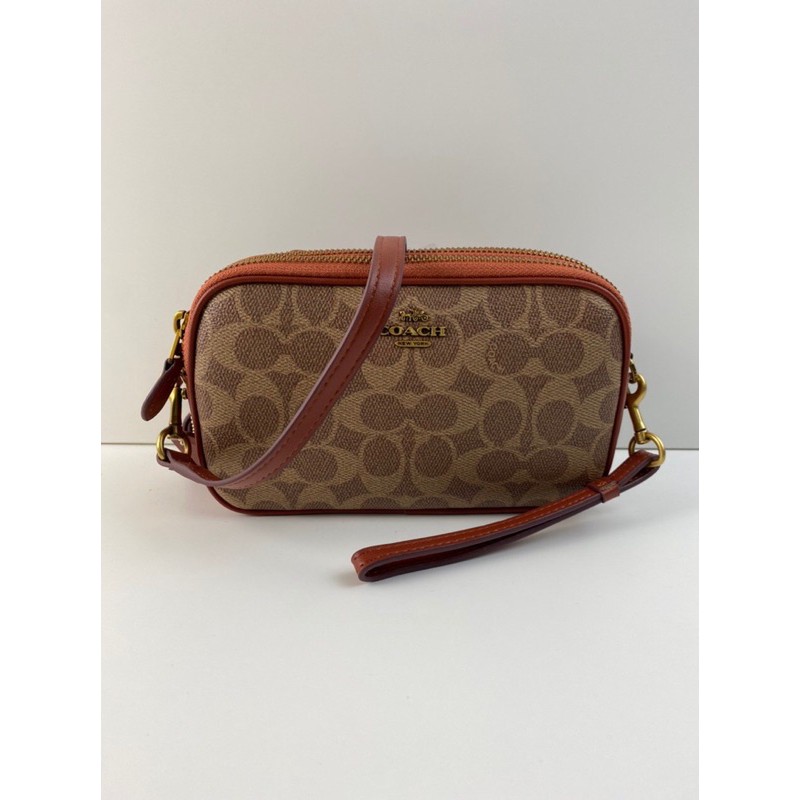 Sadie crossbody clutch on sale in colorblock signature canvas