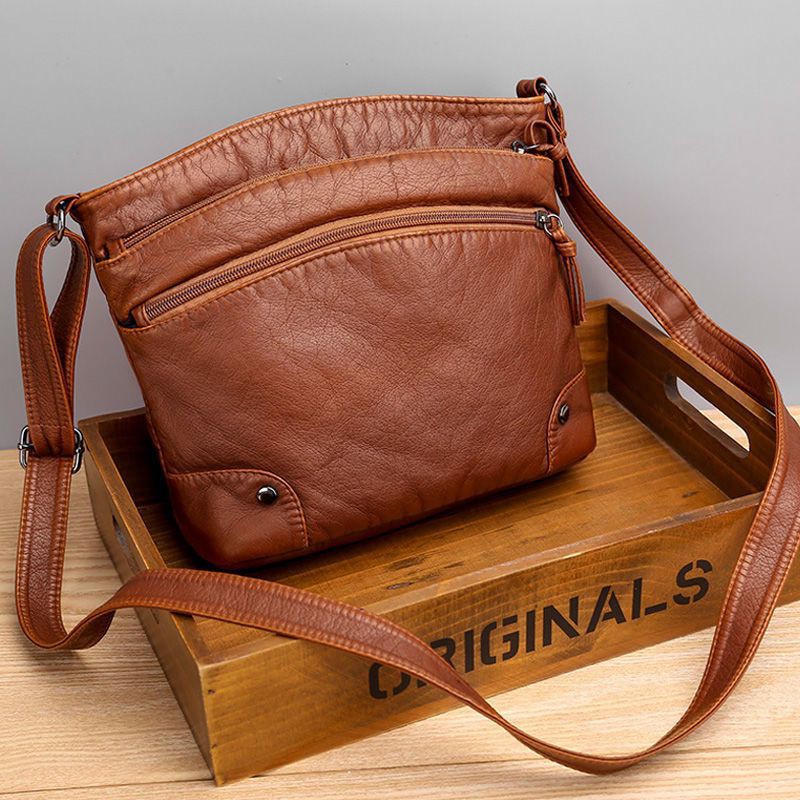 Multi compartment hot sale sling bag