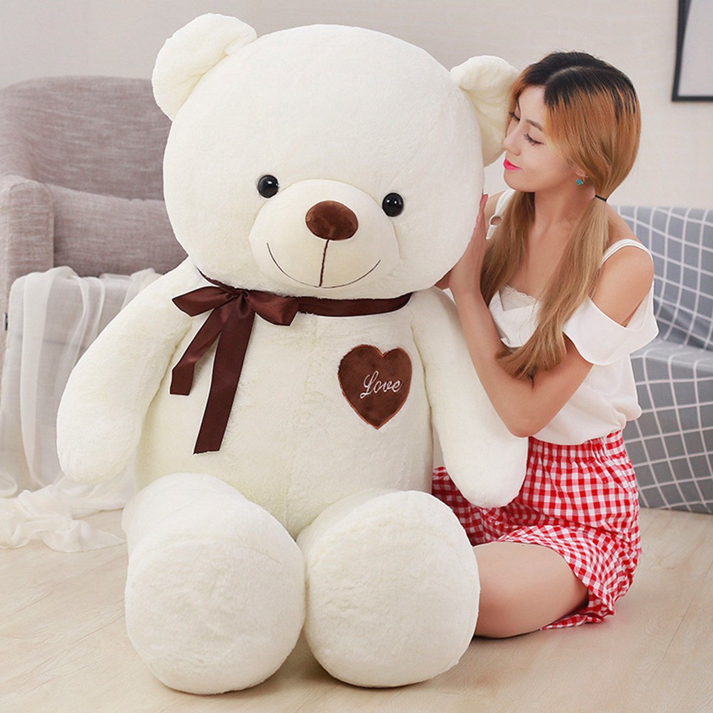 Cute girl deals with teddy bear