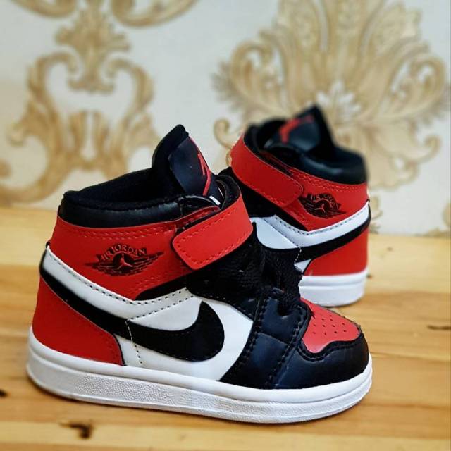 Red jordan best sale kid shoes