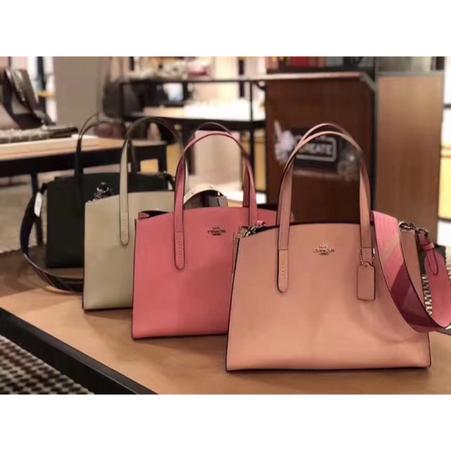 Coach charlie best sale carryall pink