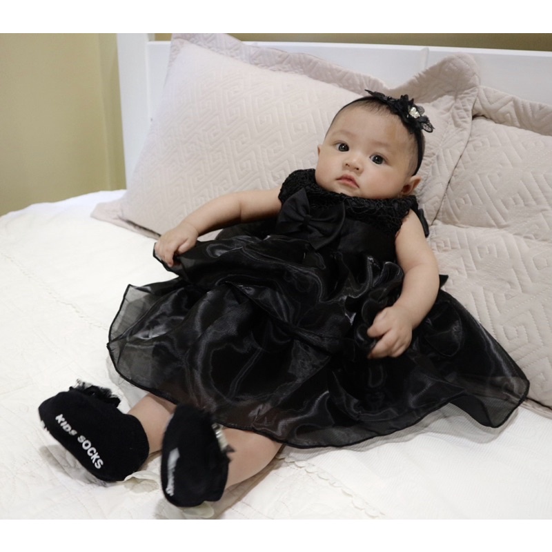 Cute baby girl in black cheap dress