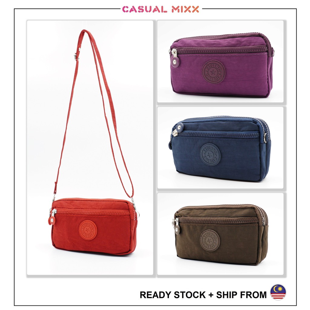 Kipling 2 way use hand carry and sling bag 6 colour multi compartment