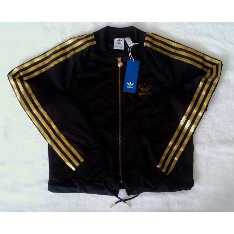 Black adidas jacket with gold outlet stripes