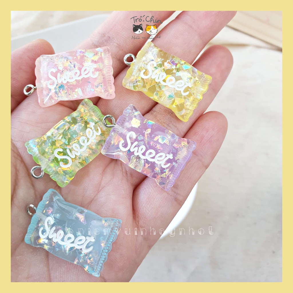 Colored candy charms in sparkling plastic, used as pendants, keychains ...