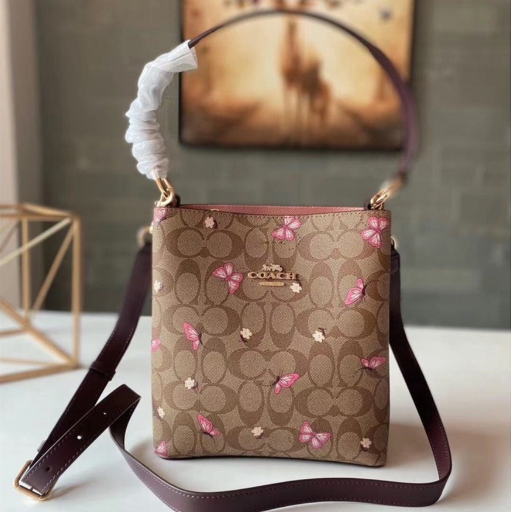 Small town bucket bag coach butterfly sale