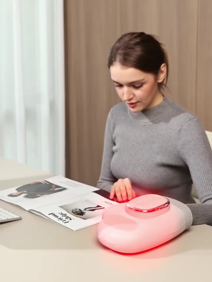 Hand massager with thermal therapy and massage functions, designed for ...