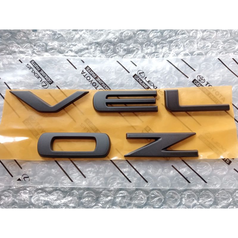 MESIN HITAM Veloz writing Emblem for separates the trunk and engine ...