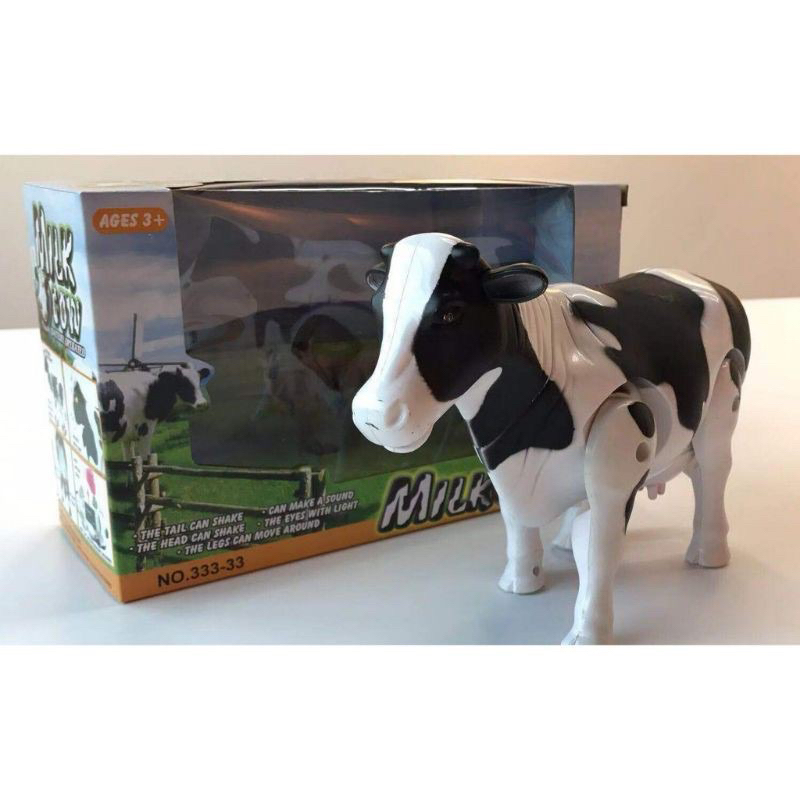 Walking mooing cow store toy