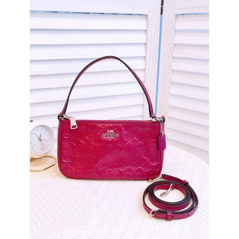 COACH TOP HANDLE POUCH IN SIGNATURE DEBOSSED PATENT LEATHER PRE LOVED