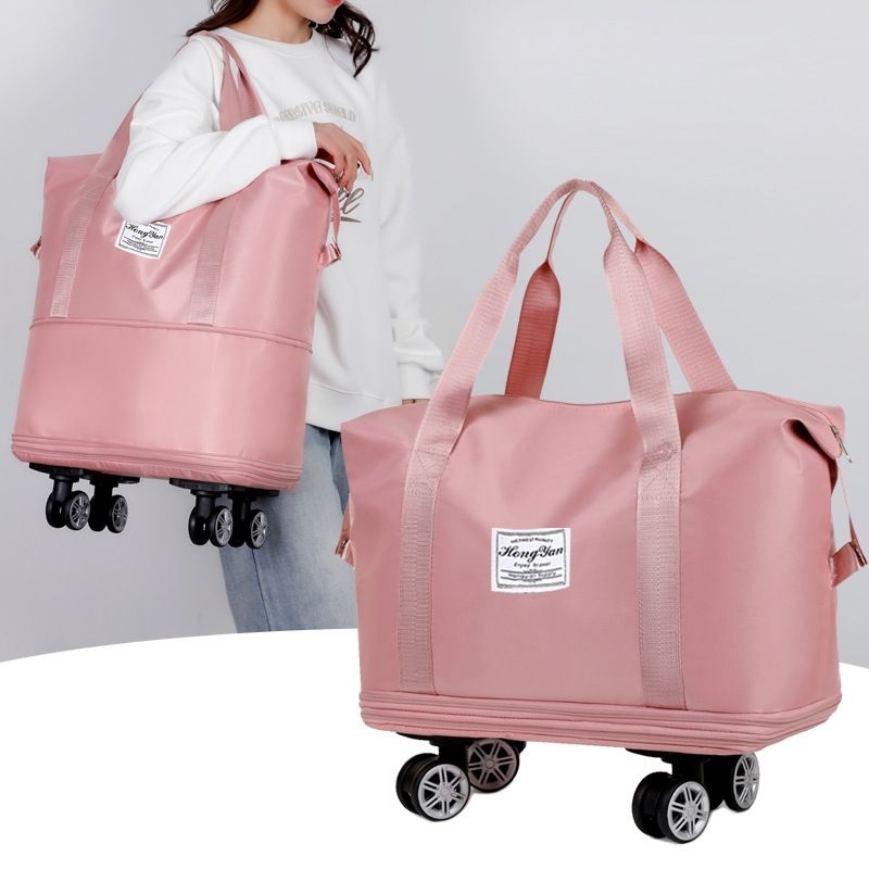 Pink duffle bag with wheels best sale