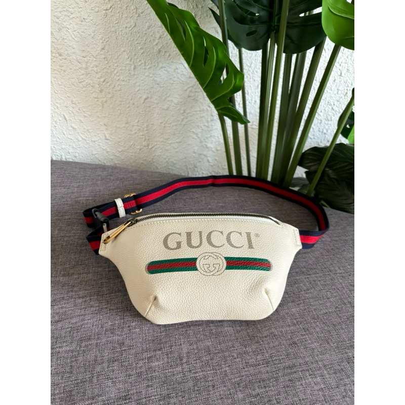 Authentic Gucci Print leather belt bag