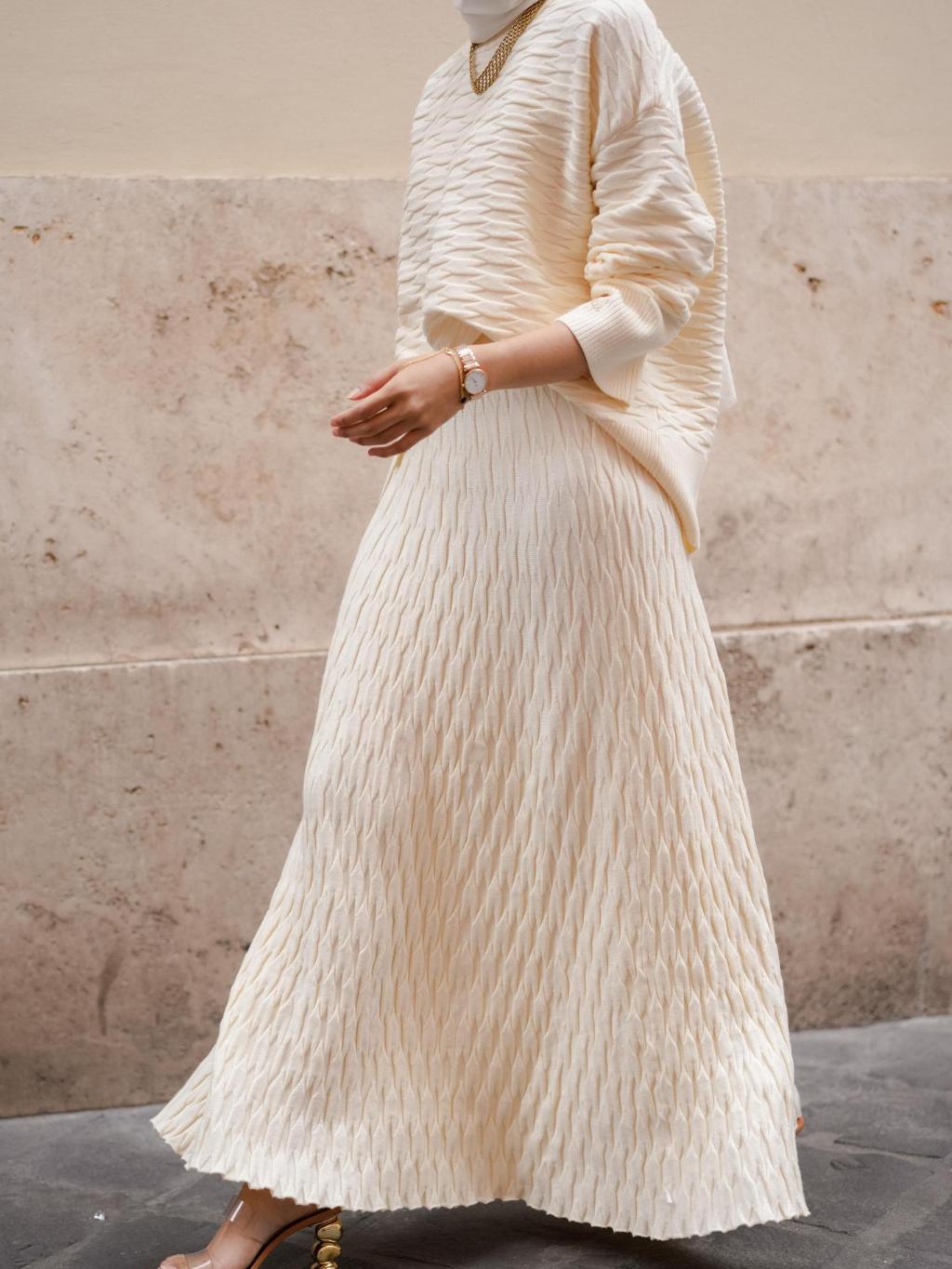 Pleated maxi skirt with a fine gauge knit top for work