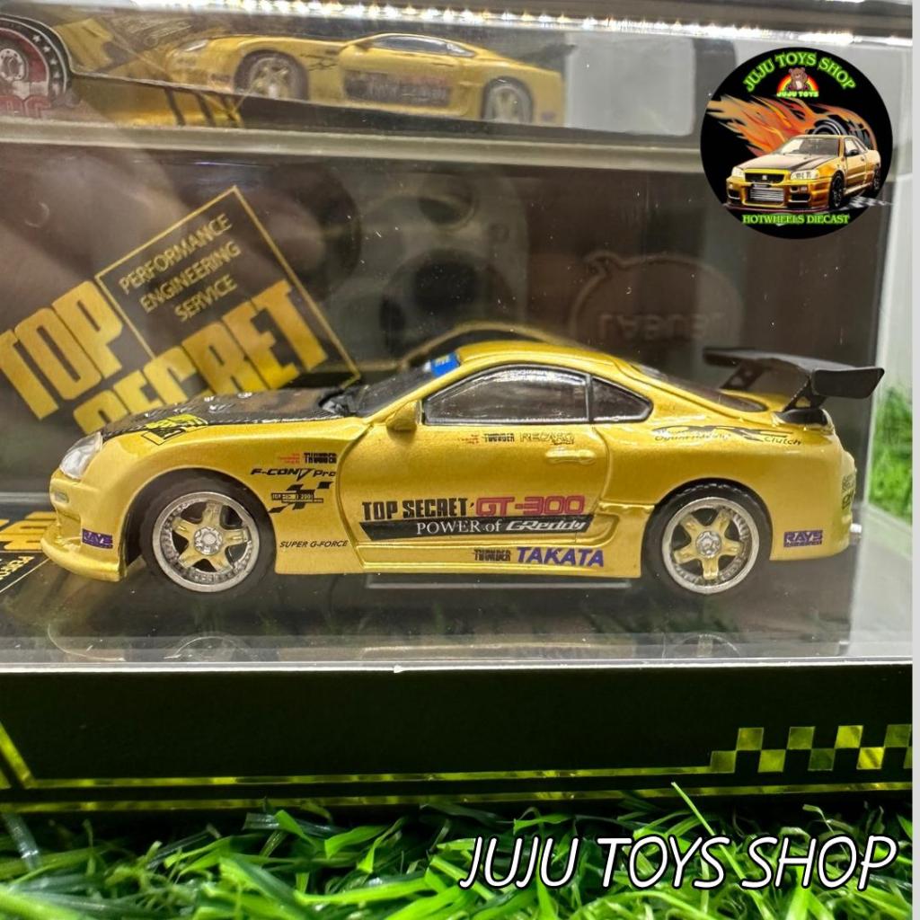 2 Miniatures Majorette 1:64 - Isuzu NPR Gold Et Toyota Supra Rouge, Neuves En Boîte