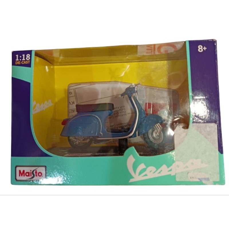 A 1:18 scale die-cast model of a blue 1969 Vespa 150 Sprint Veloce ...