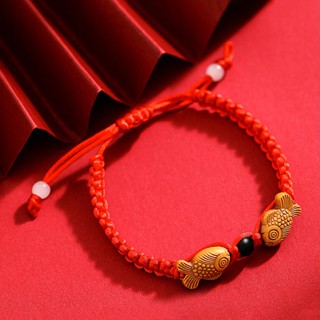 Red string fish bracelet on sale meaning