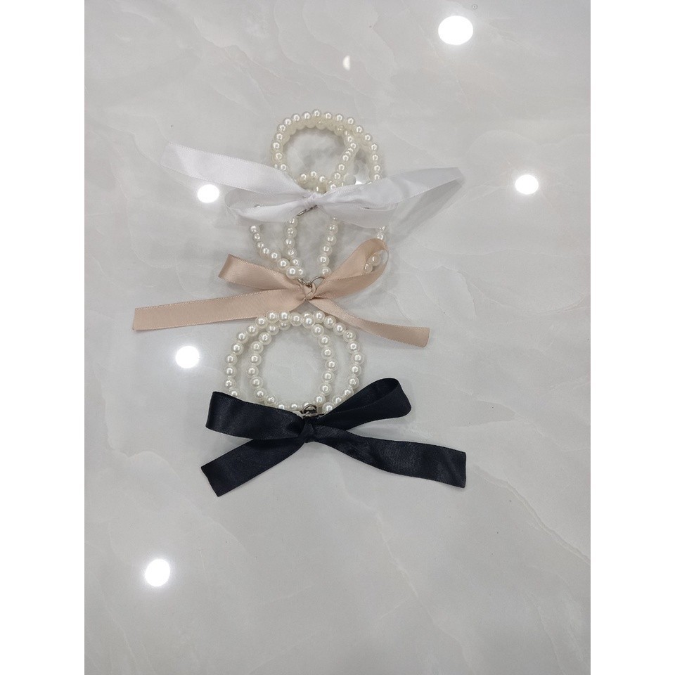 Pearl string accessory string tied with a ribbon bow to replace the ...