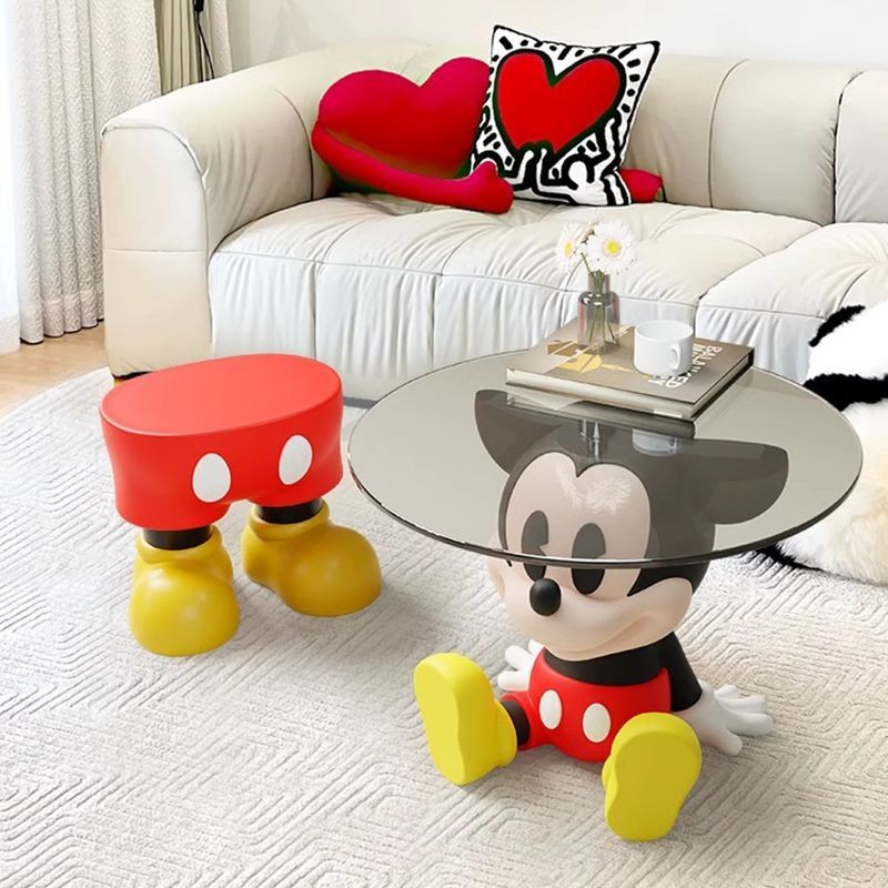 Mickey's living room, a few circular glass small coffee tables, home ...