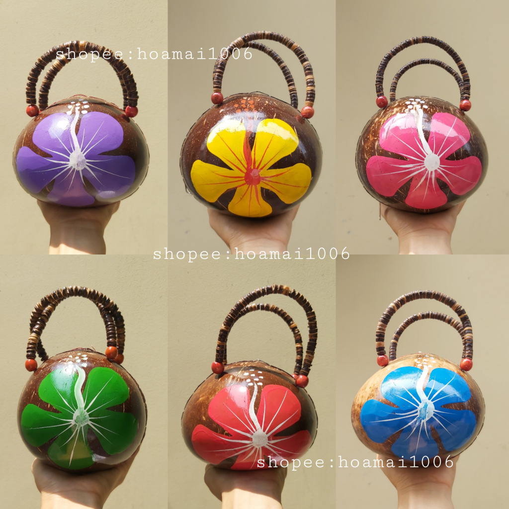 Coconut shell handbags painted with flowers as accessories for taking ...