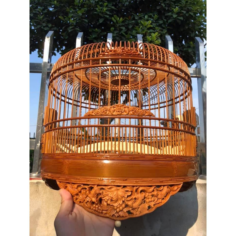 Sharply carved cuckoo cage with many models made of old bamboo material ...